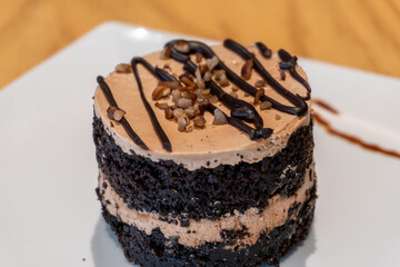 A delicious and beautiful mini chocolate cake with nuts.