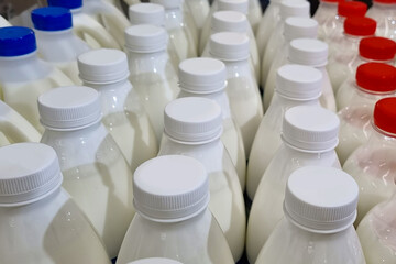 Bottles with plastic caps, top view. Lids in the colors of the French flag.