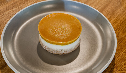 delicious vanilla cupcake with fruit mousse on wooden table