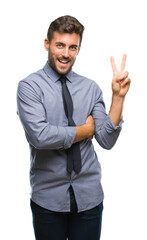Young handsome business man over isolated background smiling with happy face winking at the camera doing victory sign. Number two.