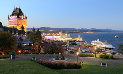 Quebec City and St. Lawrence River with a cruise ship at dusk, Canada