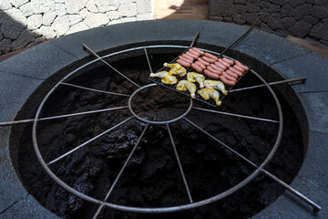 Chicken and sausages barbecued on volcanic heat, Timanfaya National Park, Lanzarote, Canary Islands, Spain
