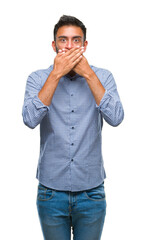 Adult hispanic man over isolated background shocked covering mouth with hands for mistake. Secret concept.