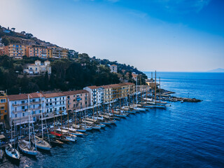 Fototapeta premium Monte Argentario fishing port and the city on the hill.