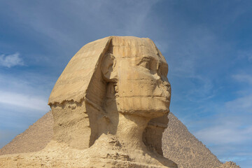 The sphinx guarding the pyramids of Egypt