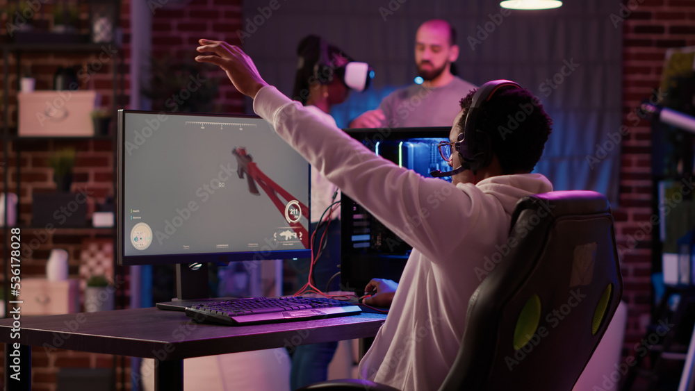 Poster gamer playing online action game testing motion sensors while gaming couple is setting up virtual re