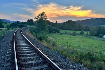 Fototapeta na wymiar train tracks in the evening landscape