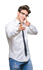 Young business man wearing glasses over isolated background pointing fingers to camera with happy and funny face. Good energy and vibes.