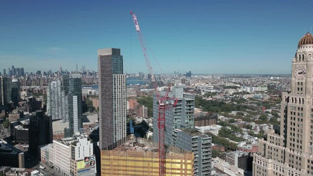 flying counter clockwise around skyscraper construction in Brooklyn NY
