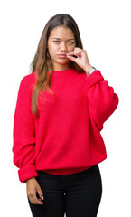 Young beautiful brunette woman wearing red winter sweater over isolated background mouth and lips...