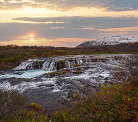 Picturesque waterfall Bruarfoss autumn view. Season changing in southern Highlands of Iceland.