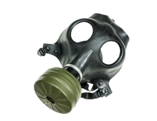 Old army surplus gas mask isolated.