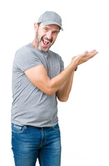 Handsome middle age hoary senior man wearing sport cap over isolated background Pointing to the side with hand and open palm, presenting ad smiling happy and confident