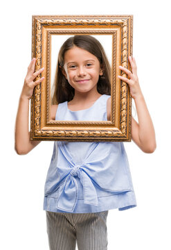 Brunette hispanic girl holding vintage art frame with a happy face standing and smiling with a confident smile showing teeth