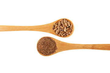 Presscake of seeds Milk Thistle, Silybum marianum seeds in wooden spoon, close-up, top view