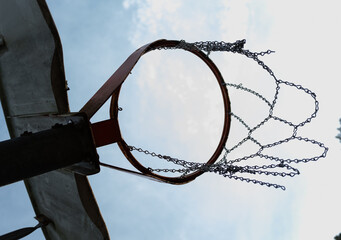 Playground basketball hoop with chain net.  - Powered by Adobe
