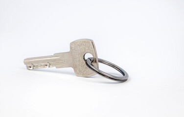 House key isolated on white background. Real estate and insurance concept