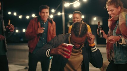 Dance circle, party and diversity friends bond, cheers and enjoy fun friendship reunion at rooftop celebration event. Black man dancing, crazy energy and group of people, students or crowd celebrate - Powered by Adobe