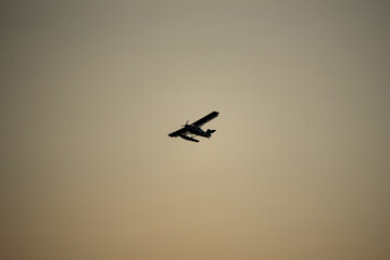 Fototapeta premium silhouette of an airplane flying in the sky