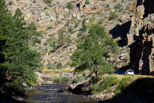 Car on the scenic drive along the Cache La Poudre Wild and Scenic River in Colorado