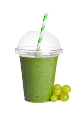 Plastic cup of detox smoothie and grapes on white background