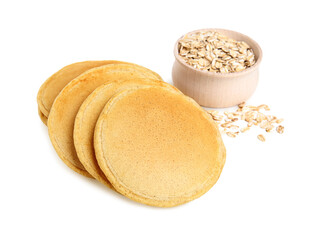 Tasty oatmeal pancakes and flakes on white background