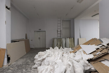 Used and new building materials in room prepared for renovation