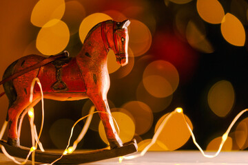 Christmas tree toys in vintage style.Christmas and New Year background. Wooden horse on shining...