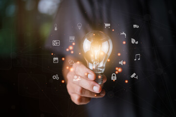 Man holding light bulb. The new innovation of the Future. Concept of smart home technology, device control automated for house.  innovation system security.