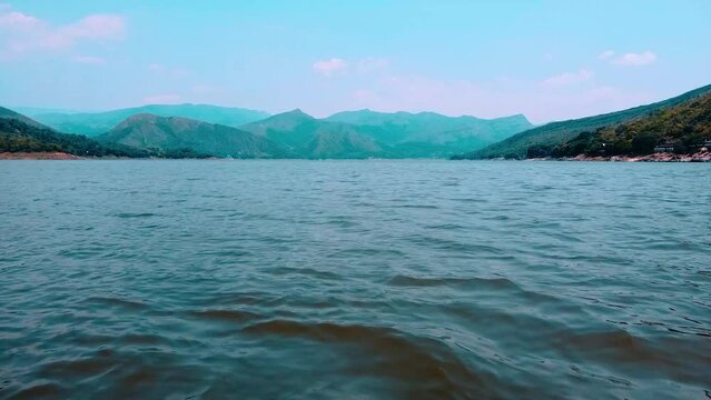 Aerial view of the prado dam where you can see a lot of water like the sea in tolima colombia - family vacations concept on water