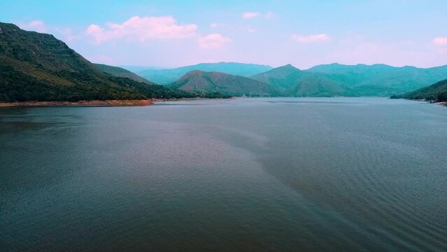 Kinematic aerial view of the beautiful dam of prado in tolima colombia. inland sea of the country. concept of vacations or landscapes