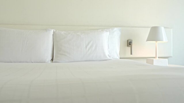 White Room in Boutique Hotel, Clean Sheets and Pillow, Close Up Pan