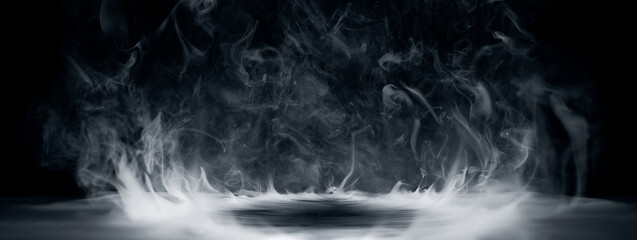 Fototapeta premium Real smoke exploding outwards with empty center. Dramatic smoke or fog effect for spooky Halloween background.