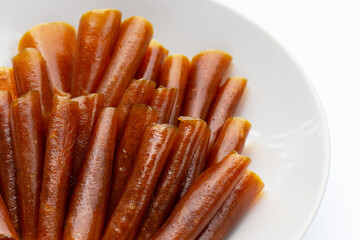 Dried mango paste sheets on white background.