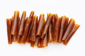 Dried mango paste sheets on white background.