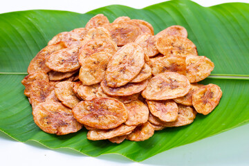 Banana chips on white background