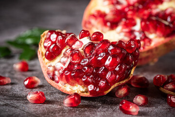 ripe red pomegranate fruit on table