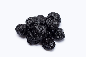 Dried prunes on white background