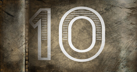 Composite of number 10 against rusty metallic background, copy space