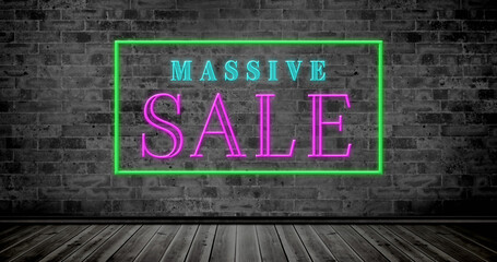 Composite of illuminated massive sale text in rectangle box against brick wall, copy space