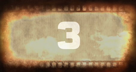 Composite of number 3 text over old rusty negative camera film with vignette, copy space