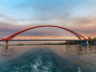 Fototapeta na wymiar Bugrinsky Bridge over the River Ob in big city Novosibirsk, Russia, sunrise or sunset, evening view