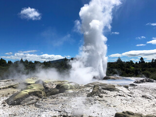 Rotorua geothermal hot spring geyser erupting and thermal mud pools., North Island, New Zealand