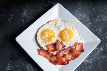 bacon with eggs on the table