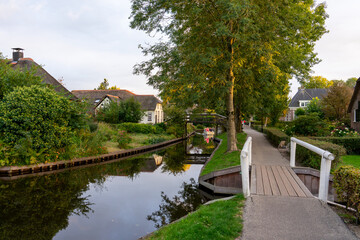 Fototapeta premium Giethoorn Netherlands Venice of the North old house in the village center along the canals with bridge