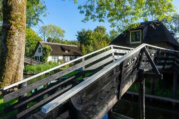 Fototapeta premium Giethoorn Netherlands Venice of the North old house in the village center along the canals with bridge
