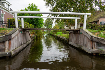 Giethoorn Netherlands Venice of the North old house with bridge and waterway