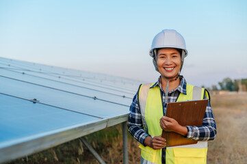 Young inspecotor female checking operation photovoltaic solar panel