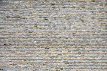 Background from a large wall made of gray bricks