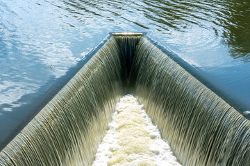 Water flowing in ditch inlet. Weir water stripes pattern,use for background and texture. - 536218691